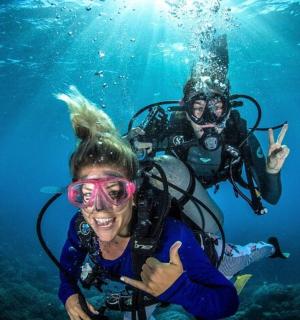 two people in the water posing for a picture