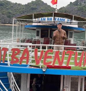 a man standing on the top of a boat