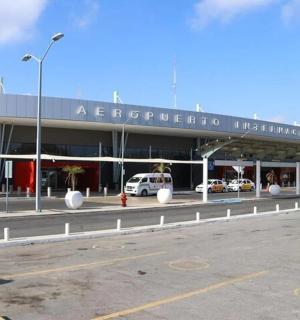 a building with cars parked in a parking lot