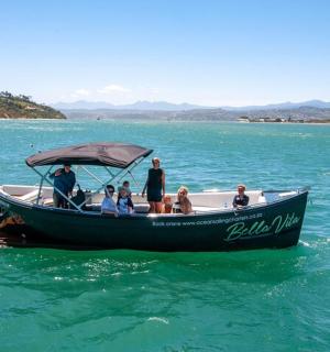 a group of people on a boat in the water