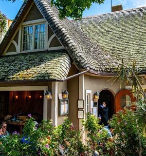 a house with people sitting outside of it