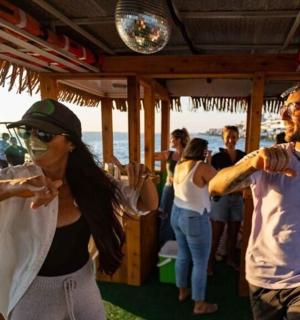 a group of people standing on a boat