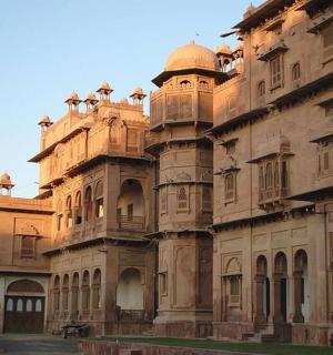 a large stone building with domes on top of it
