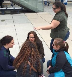 a group of women sitting on the ground