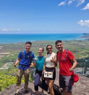 a group of people standing on top of a mountain