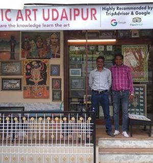 two men standing in front of a building