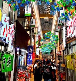 a group of people walking through a shopping mall