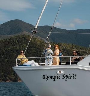 a group of people on a boat in the water