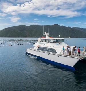 a group of people on a boat in the water