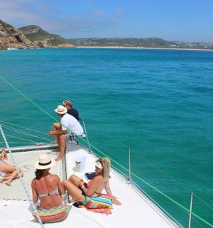 a group of people on a boat in the water