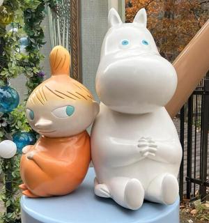 a group of statues of a cat and a dog