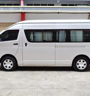 a white van parked in front of a building