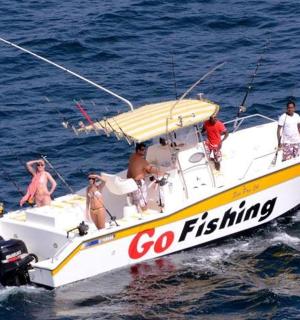 a group of people on a boat in the water