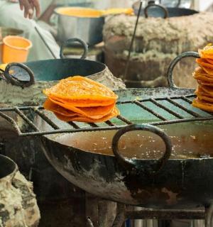 a grill with a stack of pancakes on it