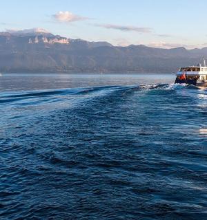 a boat in the middle of a large body of water