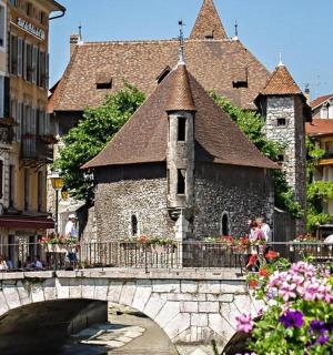 a bridge over a river in a city with buildings