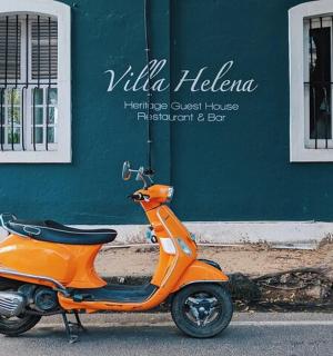 an orange scooter parked in front of a building