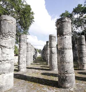 a row of columns in a cemetery