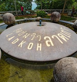 a park with a sign that says new york city