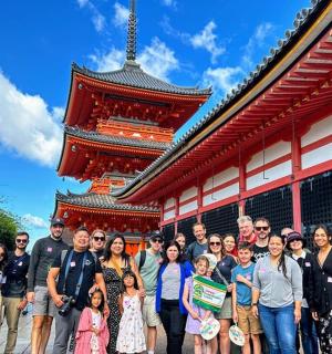 a group of people standing in front of a building