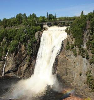 a waterfall on the side of a mountain