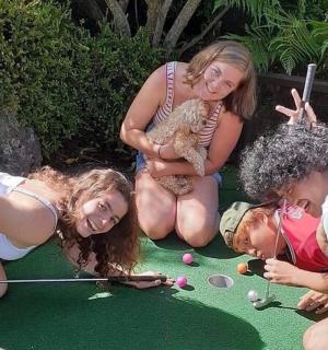 a group of people playing a game of golf