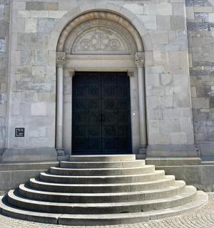 a set of stairs in front of a building with a door
