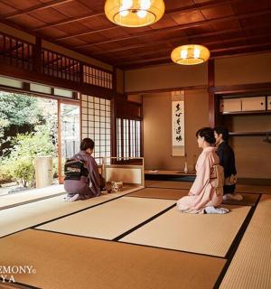 a group of people standing in a room with mats