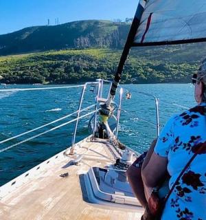 a woman sitting on a boat in the water