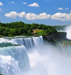 a large waterfall in the middle of a river