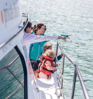 a group of people on a boat in the water