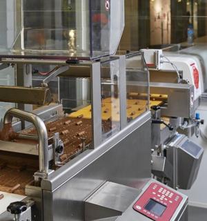 a machine that is making wood on a table