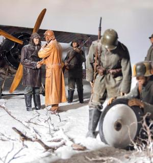 a group of people standing next to a plane