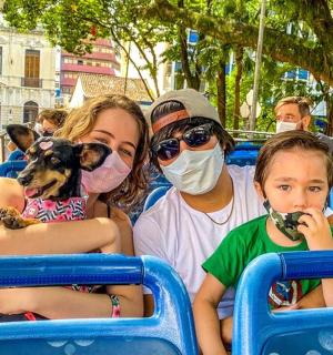 a group of people with a dog and a child