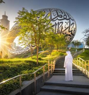 a woman walking up the stairs in a city