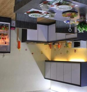 a kitchen with white cabinets and a ceiling