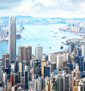 an aerial view of a large city with a harbor