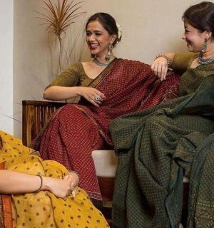a group of three women sitting next to each other