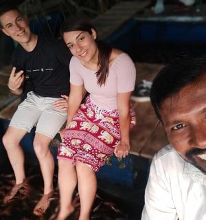 a group of three people posing for a picture