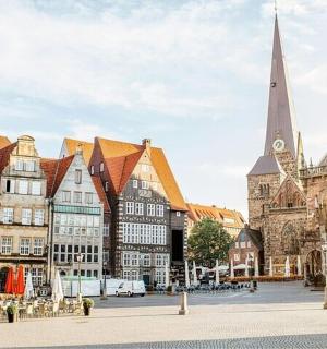 a group of buildings in a city with a church