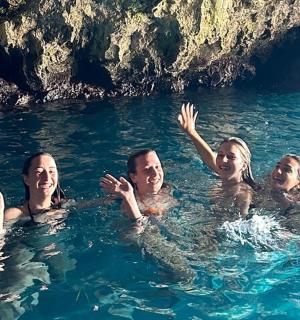 a group of people swimming in the water