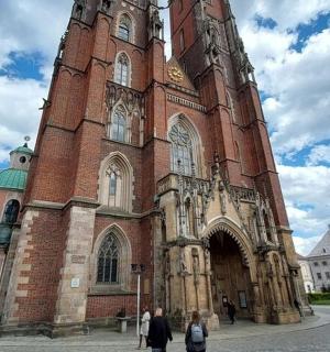 a large brick building with a clock tower