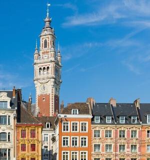 a clock tower in the middle of a city