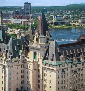 an aerial view of a large building with towers