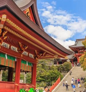 a building with people walking in front of it