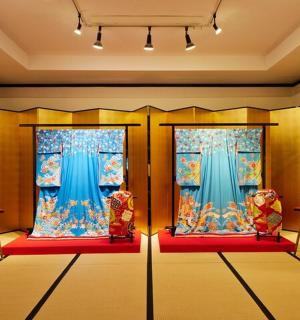 a room with two windows and two chairs