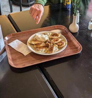 a plate of food on a tray on a table