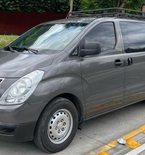 a silver van parked in a parking lot
