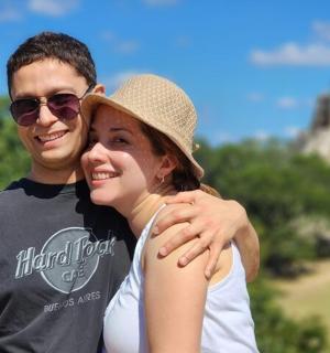 a man and a woman are posing for a picture