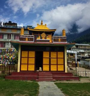 a building in front of a building with a fence
